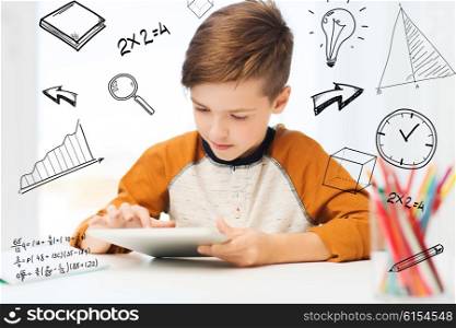 leisure, children, technology and people concept - close up of boy with tablet pc computer at home over mathematical doodles