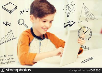 leisure, children, technology and people concept - smiling boy with tablet pc computer at home over mathematical doodles. smiling boy with tablet pc computer at home