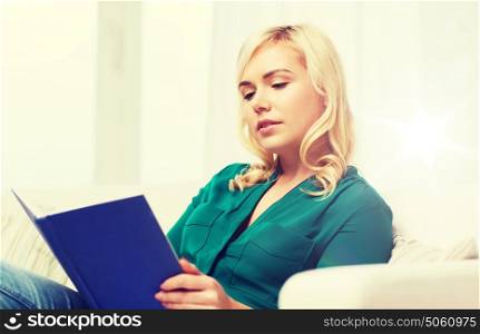 leisure, literature, education and people concept - woman reading book at home. woman reading book at home