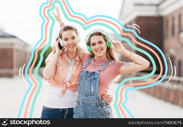 leisure, music and friendship concept - happy smiling teenage girls or best friends in headphones hugging on city street in summer with glowing lines. teenage girls or friends in headphones in city