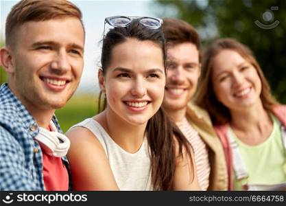 leisure, people and friendship concept - happy teenage friends outdoors in summer. happy teenage friends outdoors in summer