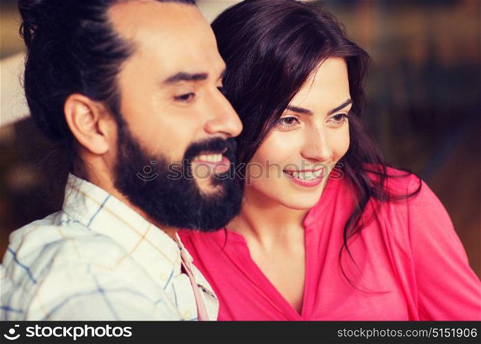 leisure, people and holidays concept - happy couple at restaurant. happy couple at restaurant