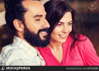 leisure, people and holidays concept - happy couple at restaurant. happy couple at restaurant