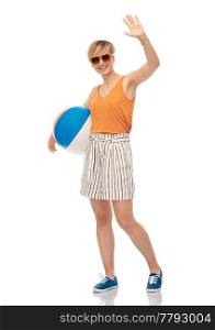 leisure, summer holidays and people concept - smiling teenage girl in sunglasses with beach ball over white background. smiling teenage girl in sunglasses with beach ball