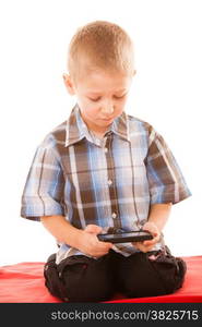 Leisure, technology and internet concept - little boy with smartphone playing games or reading text message