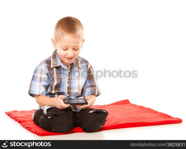 Leisure, technology and internet concept - little boy with smartphone playing games or reading text message