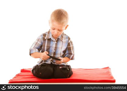 Leisure, technology and internet concept - little boy with smartphone playing games or reading text message