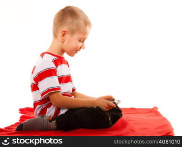 Leisure, technology and internet concept - little boy with smartphone playing games or reading text message