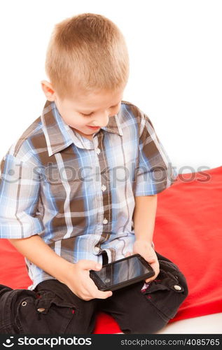 Leisure, technology and internet concept - little boy with smartphone playing games or reading text message