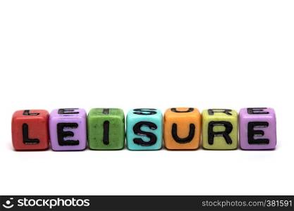 leisure - word made from multicolored child toy cubes with letters