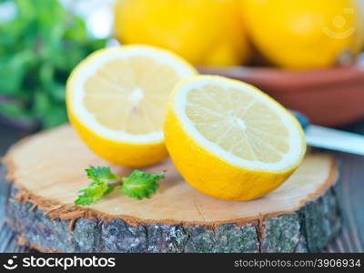 lemon and mint on the wooden table