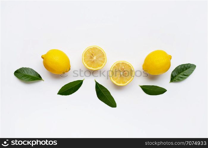 Lemon and slices with green leaves isolated on white background.