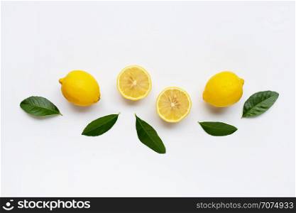 Lemon and slices with green leaves isolated on white background.
