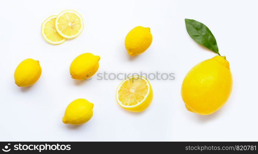 Lemon and slices with leaves isolated on white background.