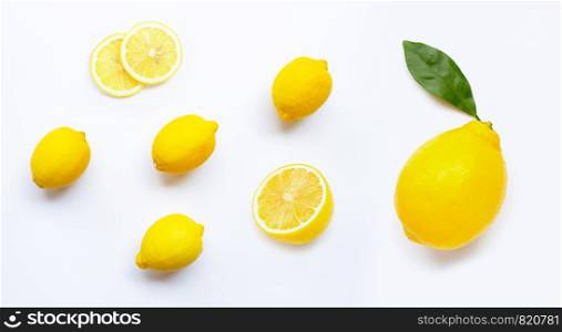 Lemon and slices with leaves isolated on white background.