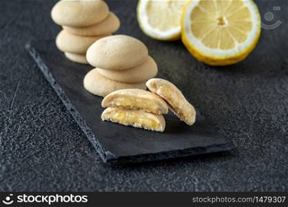 Lemon biscuits on stone board close up
