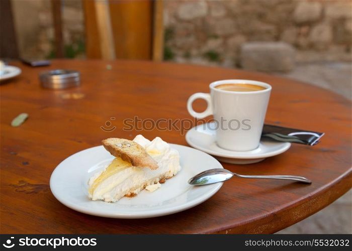 Lemon cake with hazelnut cookie and cup of coffee&#xA;