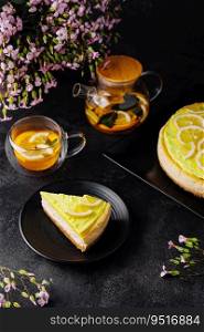lemon cheesecake with tea glass top view