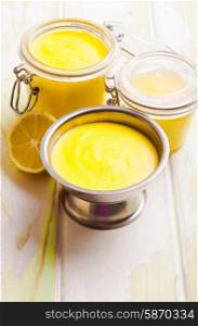 Lemon curd in glass jars on the table