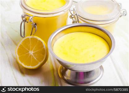 Lemon curd in glass jars on the table