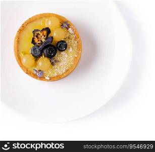 Lemon curd mini tarts on white plate