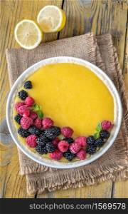 Lemon curd tart with fresh berries: top view
