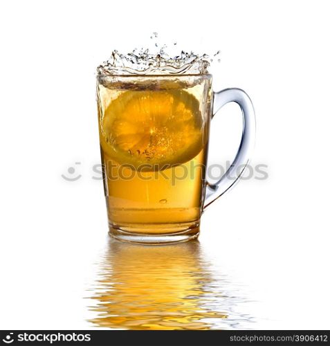lemon dropped into tea cup with splash and reflection isolated on white