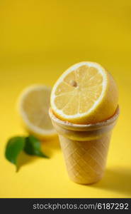 Lemon fruit in ice cream cone with lemon slices