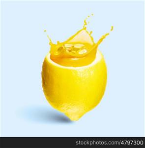 Lemon juice. Image of refreshing lemon cocktail with juicy splashes