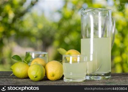 lemon juice on a wooden table, summer set, outdoor
