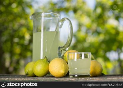 lemon juice on a wooden table, summer set, outdoor