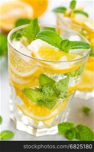 Lemon mojito cocktail with fresh mint, cold refreshing summer drink or beverage with ice