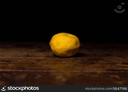 Lemon on wooden surface
