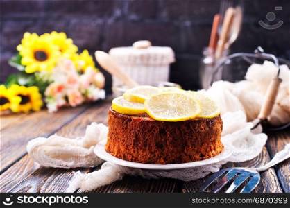 lemon pie with fresh lemons on a table
