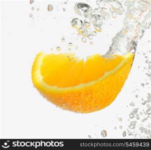 Lemon Slice falling deeply under water with a big splash on white background