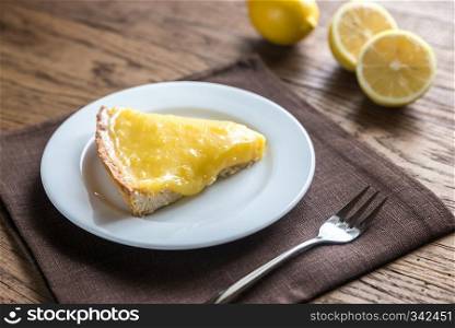 Lemon tart on the wooden background