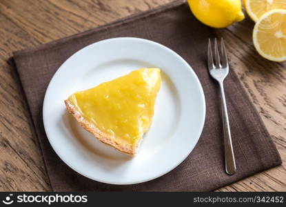 Lemon tart on the wooden background