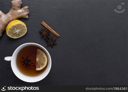 lemon tea with ginger cinnamon beside. High resolution photo. lemon tea with ginger cinnamon beside. High quality photo