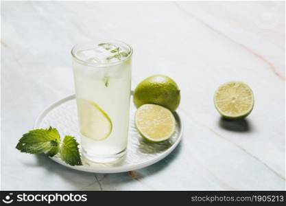 lemonade glass limes bamble background. Beautiful photo. lemonade glass limes bamble background