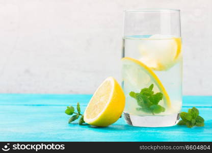 Lemonade homemade drink - one glass with ice and mint. Lemonade homemade drink