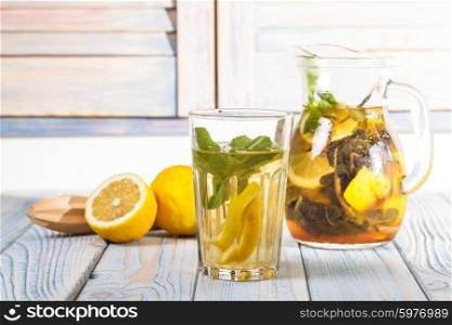 Lemonade on the table in the kitchen. Lemonade in glass