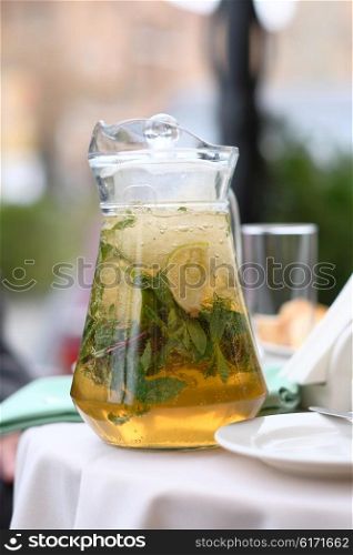 Lemonade pitcher at restaurant outdoor table