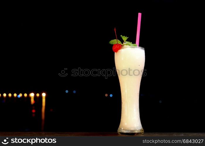 lemonade shake drink in glass with mint leaf and cherry on top