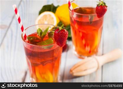 Lemonade with a strawberry, lemon and mint