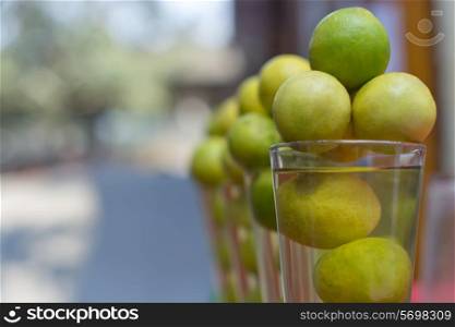 Lemons arranged in glass at store