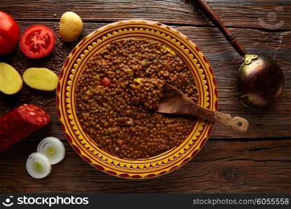 Lentil soup plate Mediterranean recipe on aged wood background