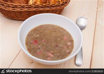 Lentil Soup With Smoked Meat on Wooden Table