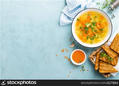 Lentil soup with vegetables and fresh parsley on plate