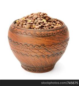 Lentils in a clay pot isolated on white background. Healthy food.