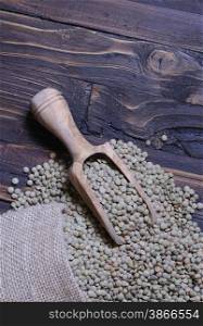 Lentils on wooden table in the kitchen